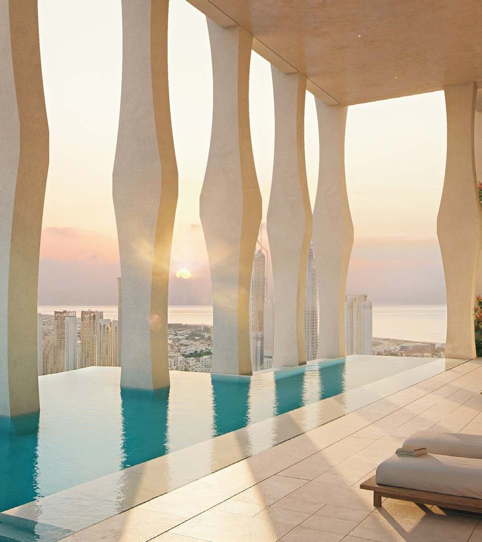 Infinity-edge pool at sunset, framed by the sculpted colonnade